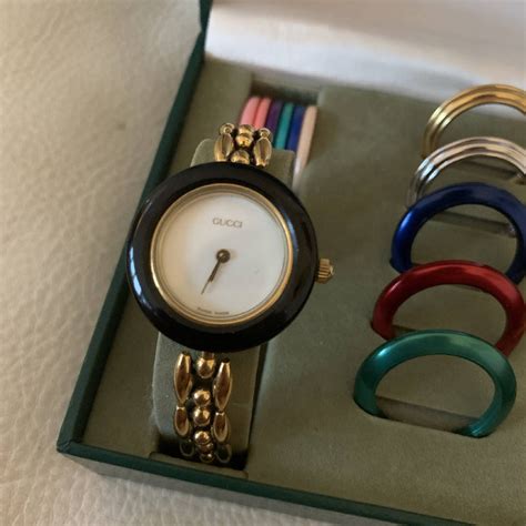 gucci ladies gold bangle bezel watch|Gucci interchangeable bezel.